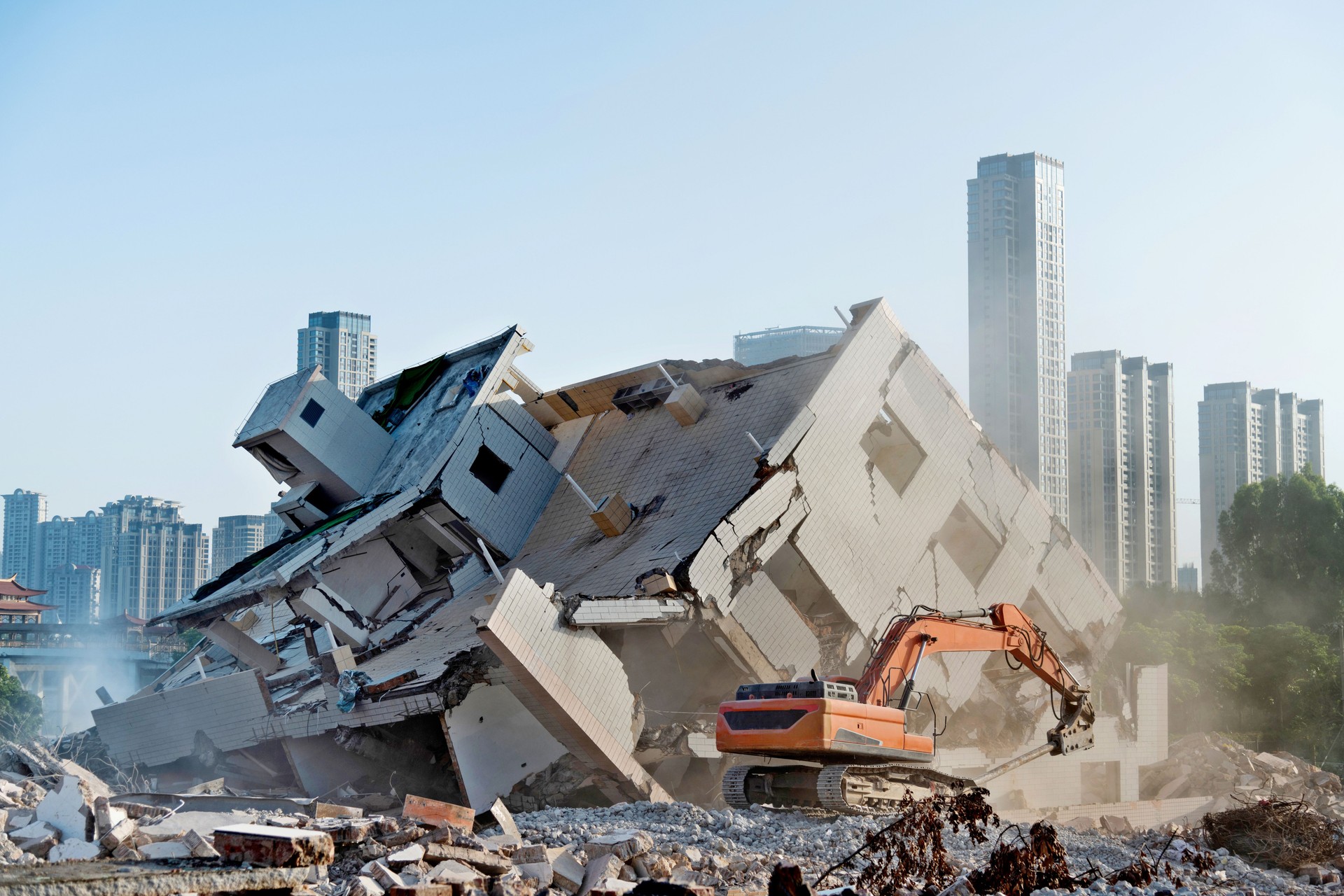 Construction machinery is demolishing the house